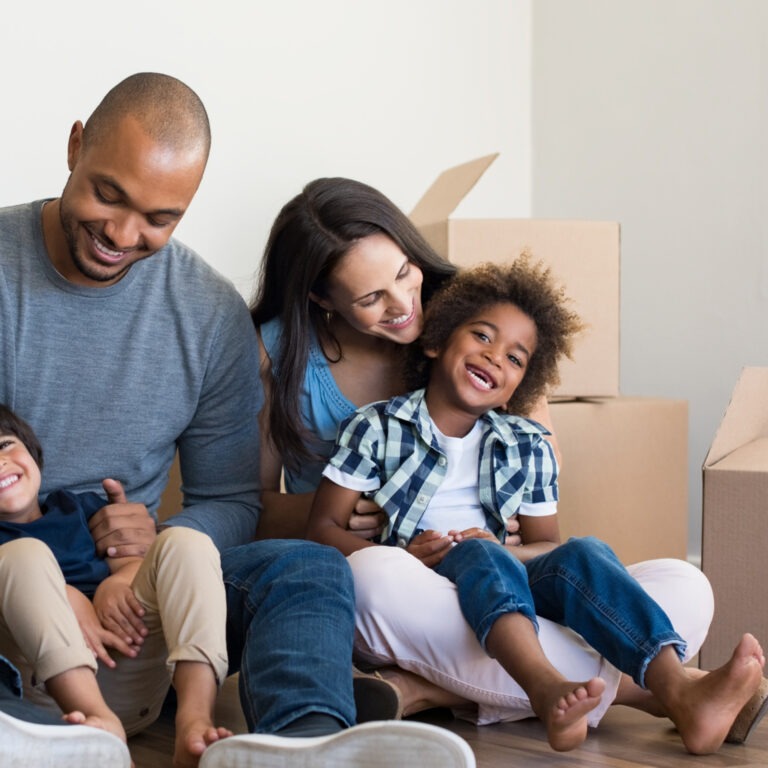 Happy Family with boxes on moving day