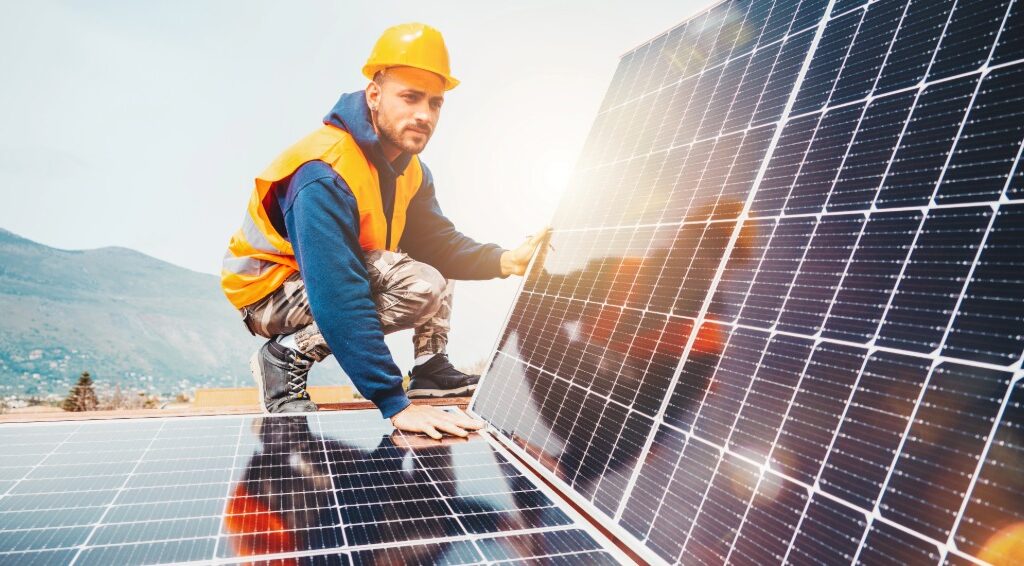 Man installing solar panels